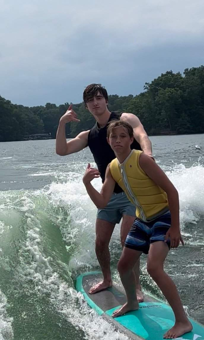 Kids enjoying a private surf charter on Lake Lanier with family-friendly activities